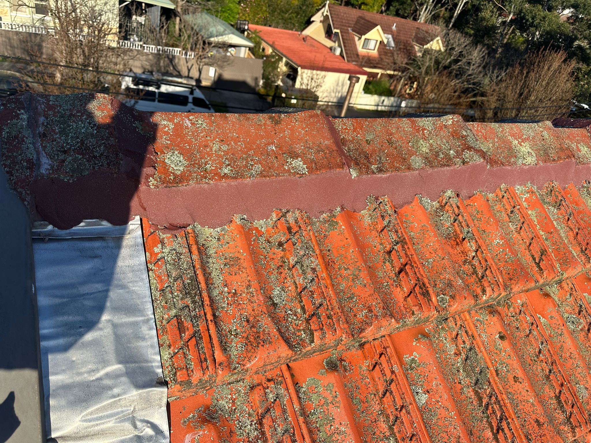 Ridge cap repointing in progress